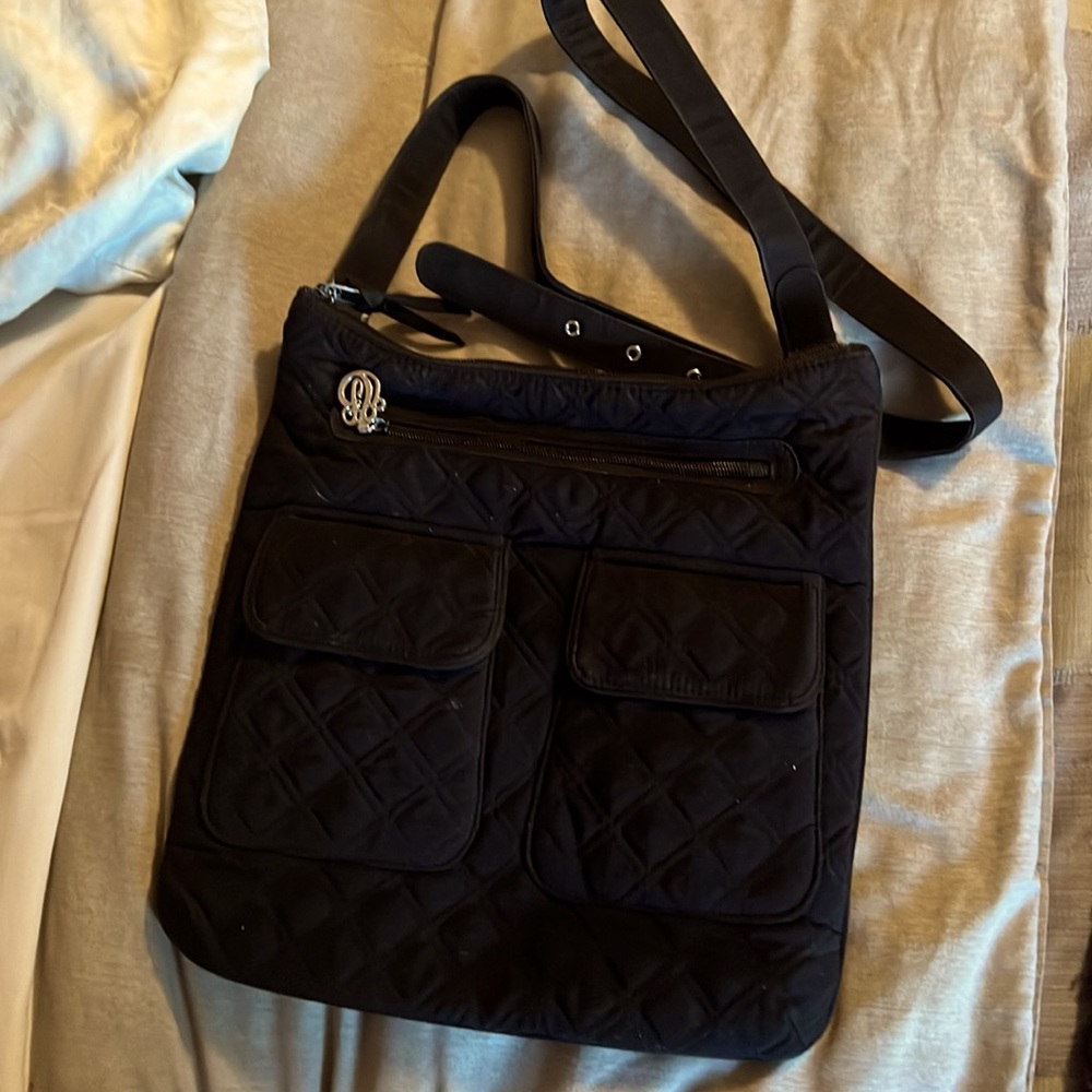 Vera Bradley black purse 2 front pockets.